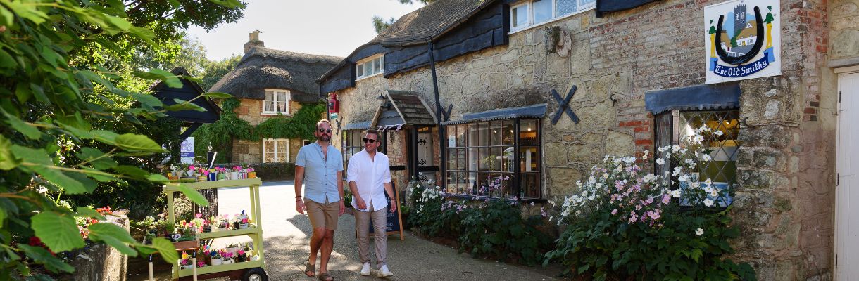 Couple walking through Godshill Village